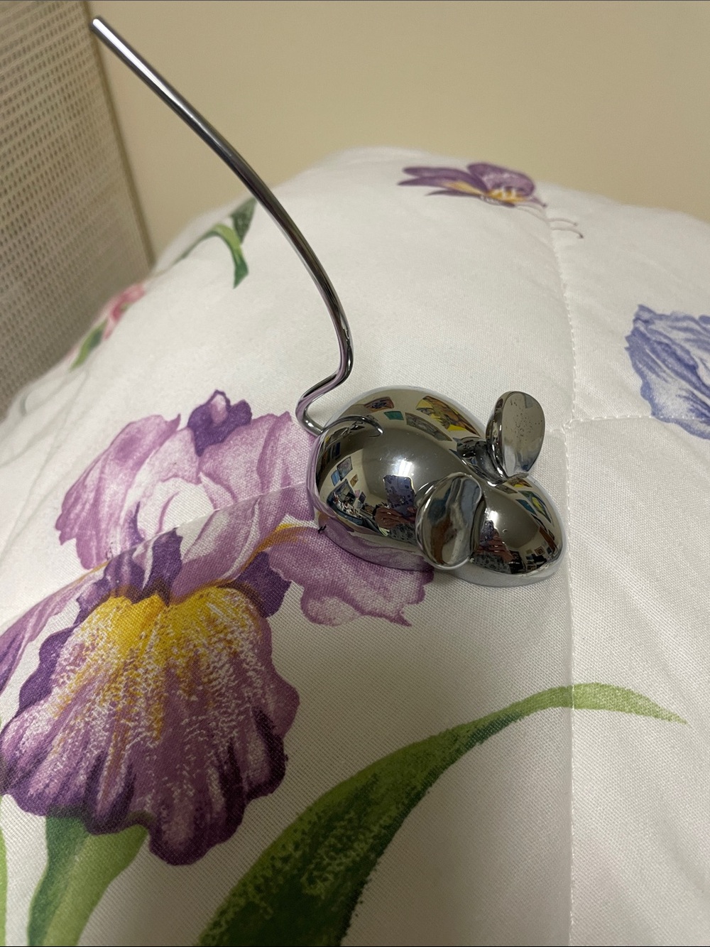Jewelry silver mouse to hold your rings. Three costume rings.